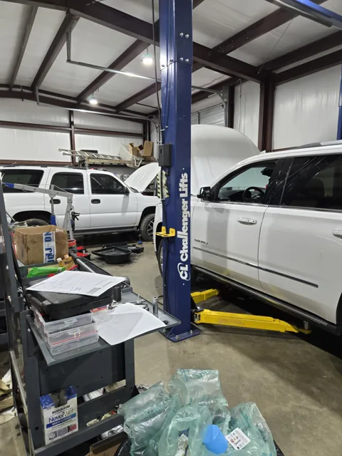 Vehicles in the Big 3 repair bays