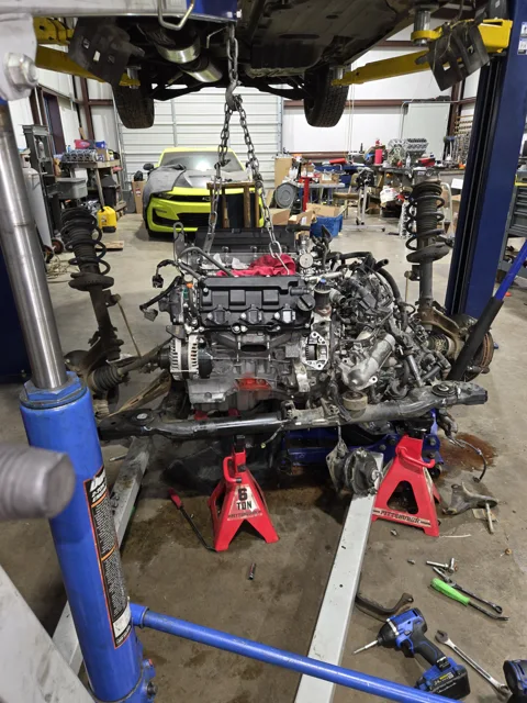 Drivetrain work beneath a vehicle lift